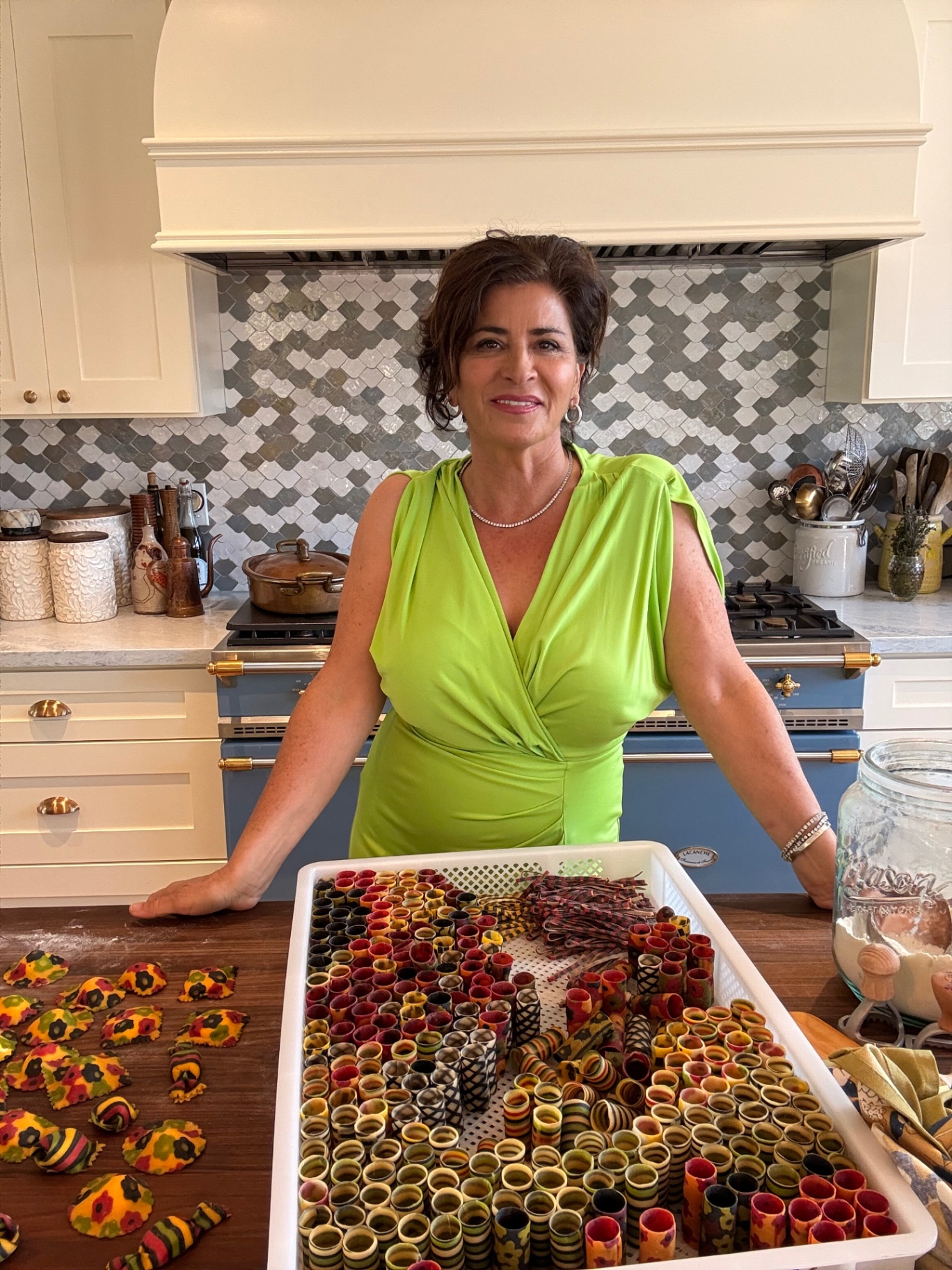 Fiona Afshar in her kitchen with colorful handmade pasta and fresh dough